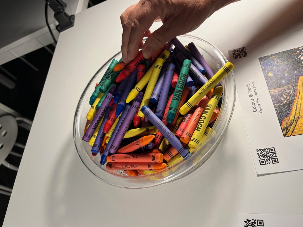 Crayon coloring station at the Van Gogh The Immersive Experience in Albany